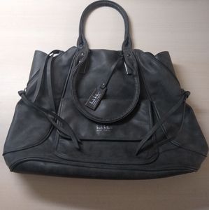 Nicole Miller style purse elegant and sleek in des